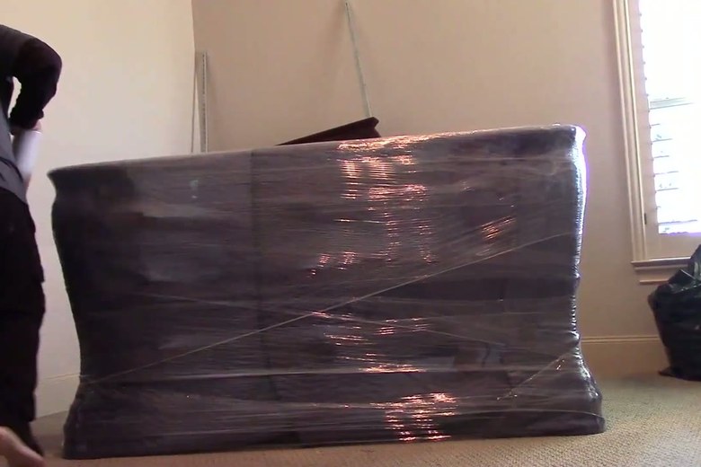 Shrink-wrapping a dresser for the move